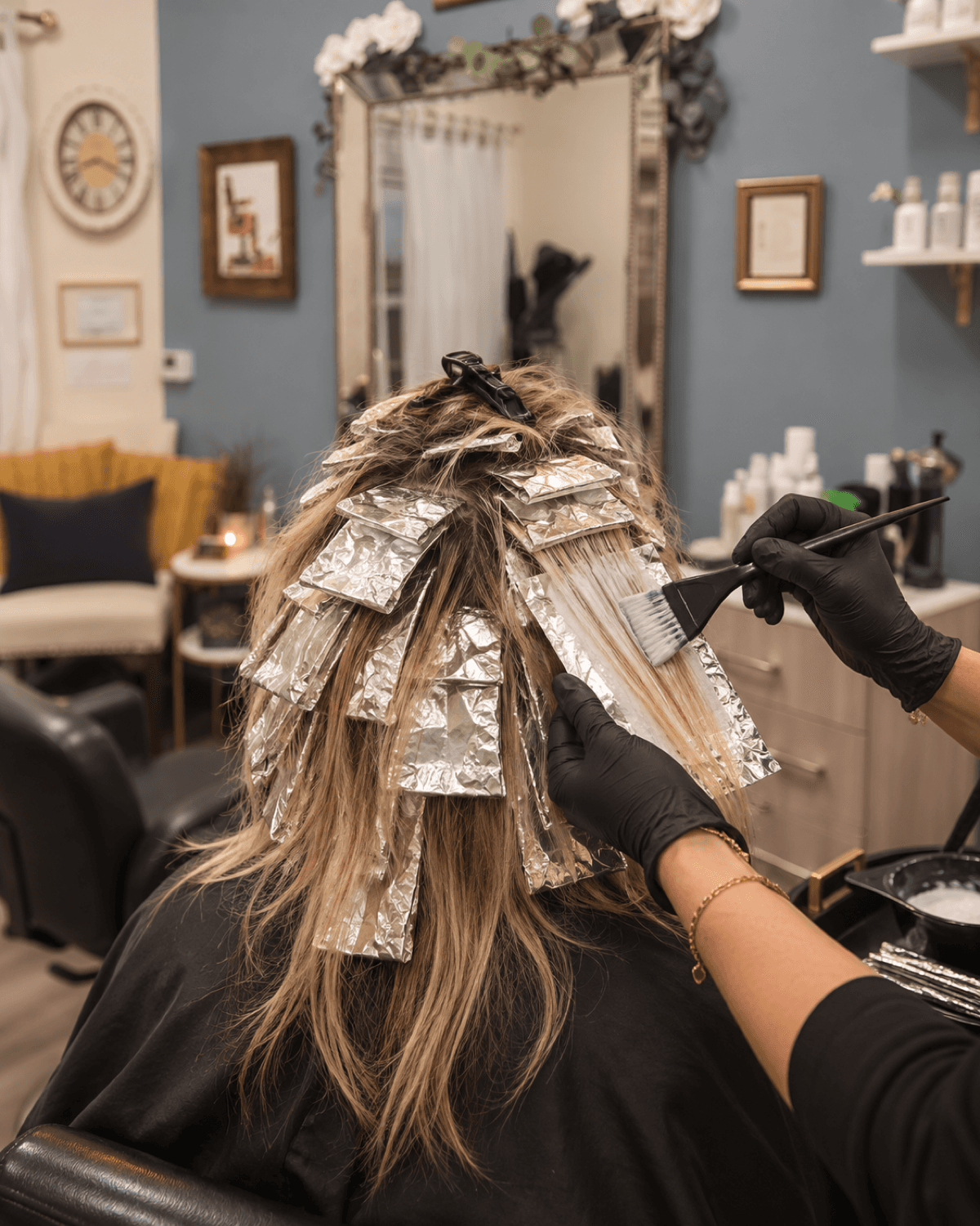 Full head of hair foils during a highlighting service