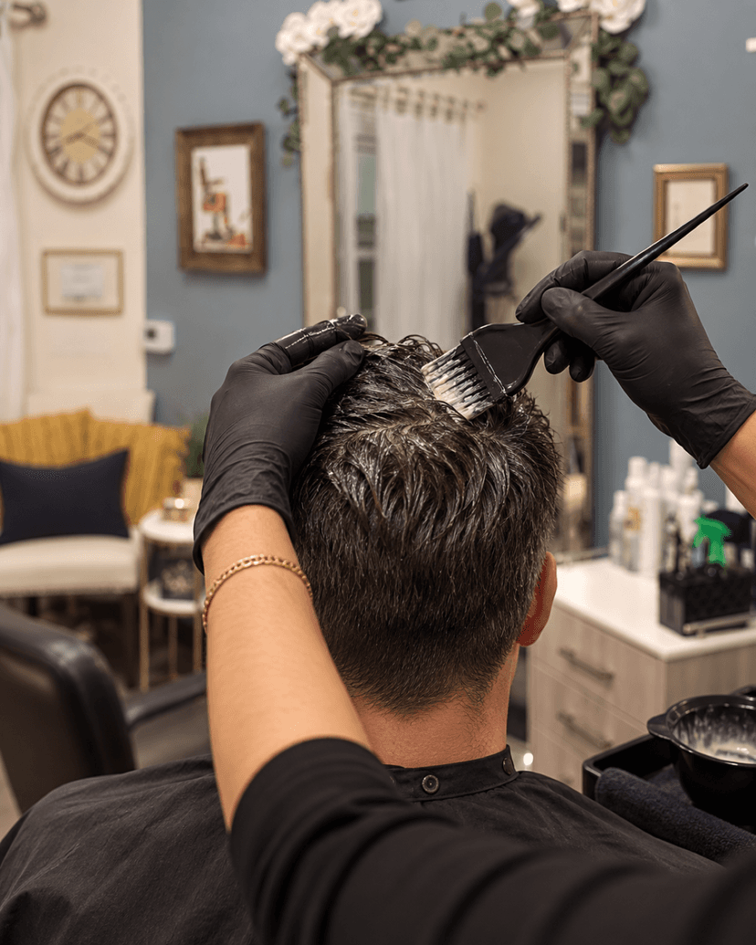 Close-up of men's hair color application